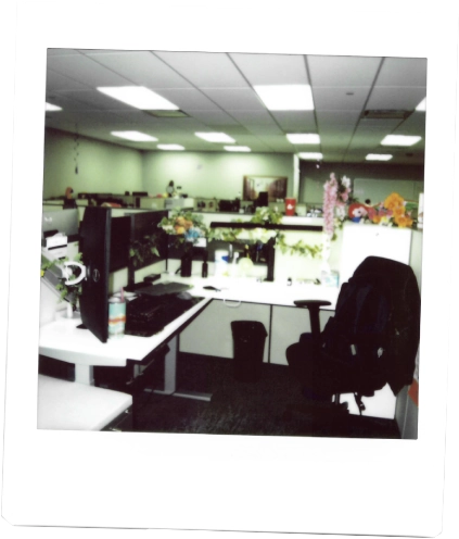 Photo of a cubicle that has been decorated with flowers